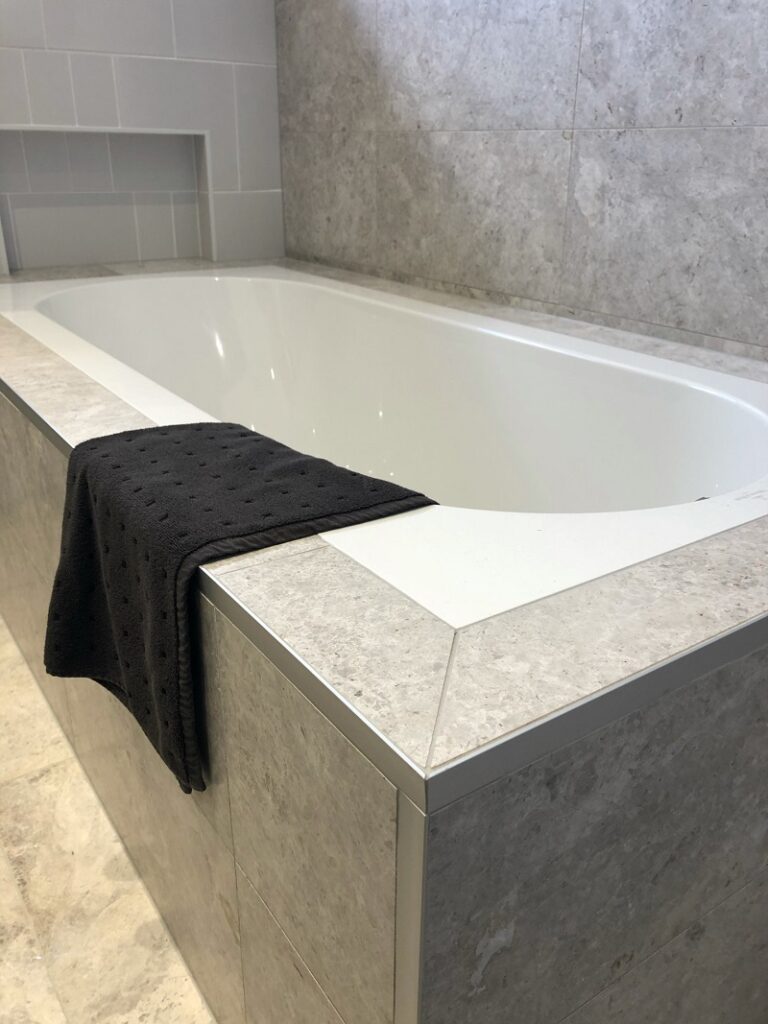 Stylish stone bathtub in a modern bathroom