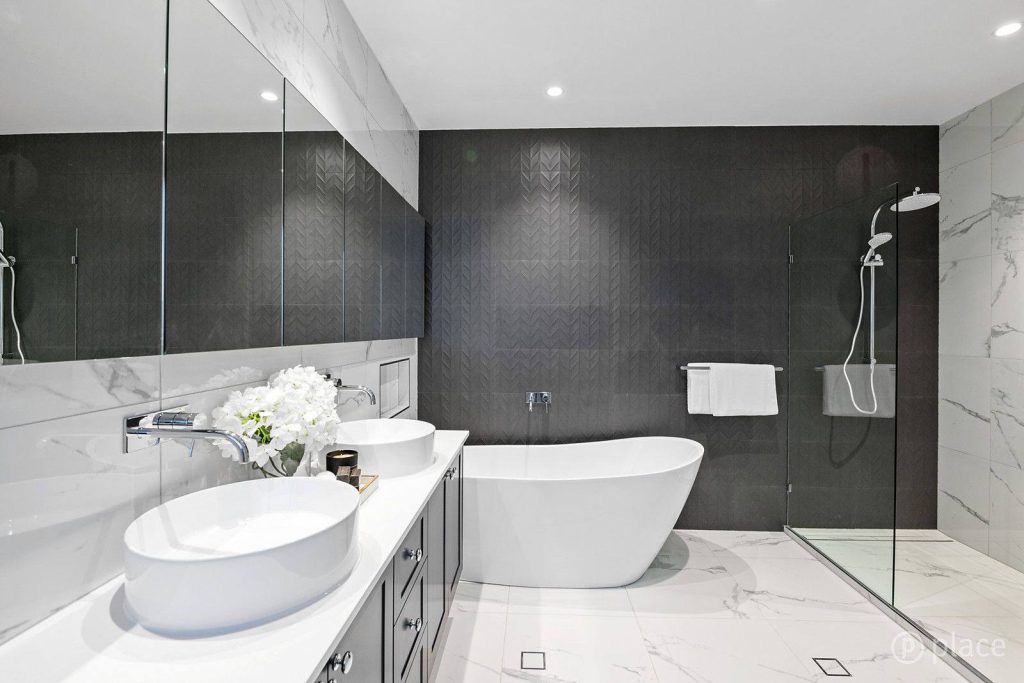 A beautifully renovated bathroom showcasing a new bathtub